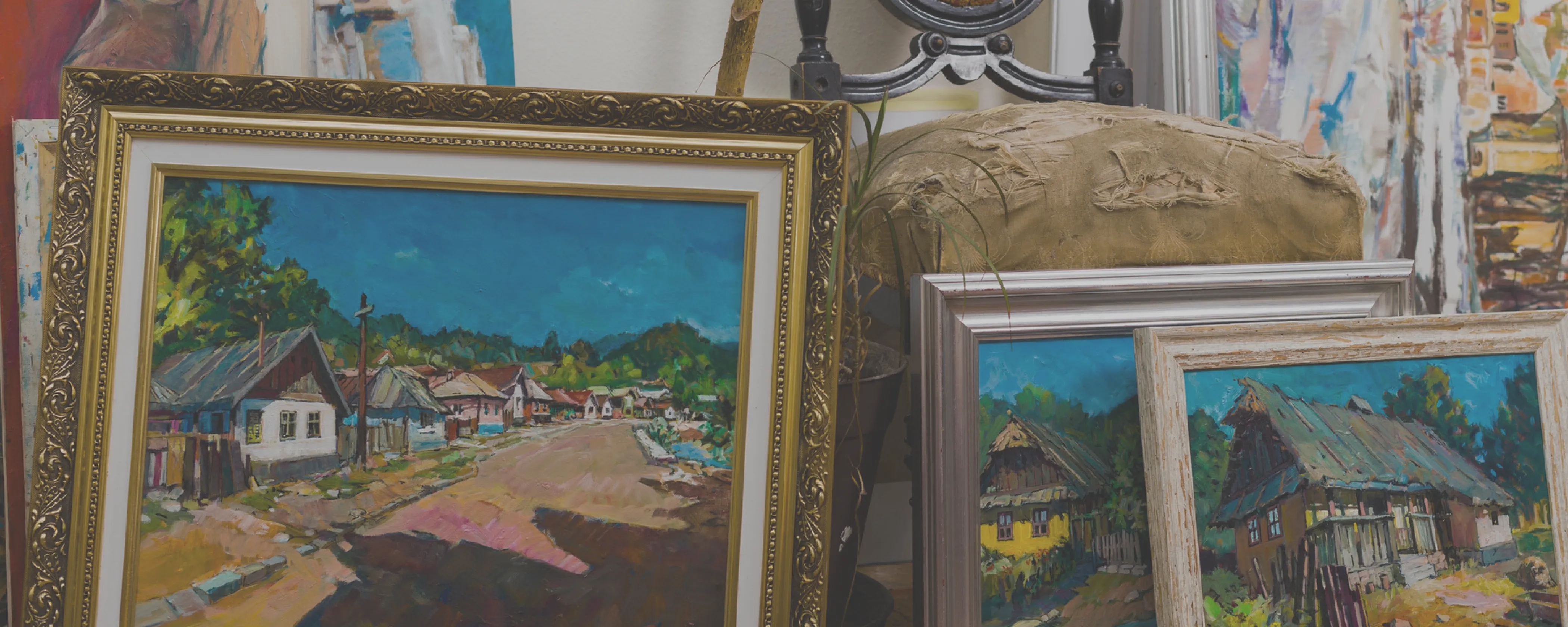 Collection of framed paintings and antiques